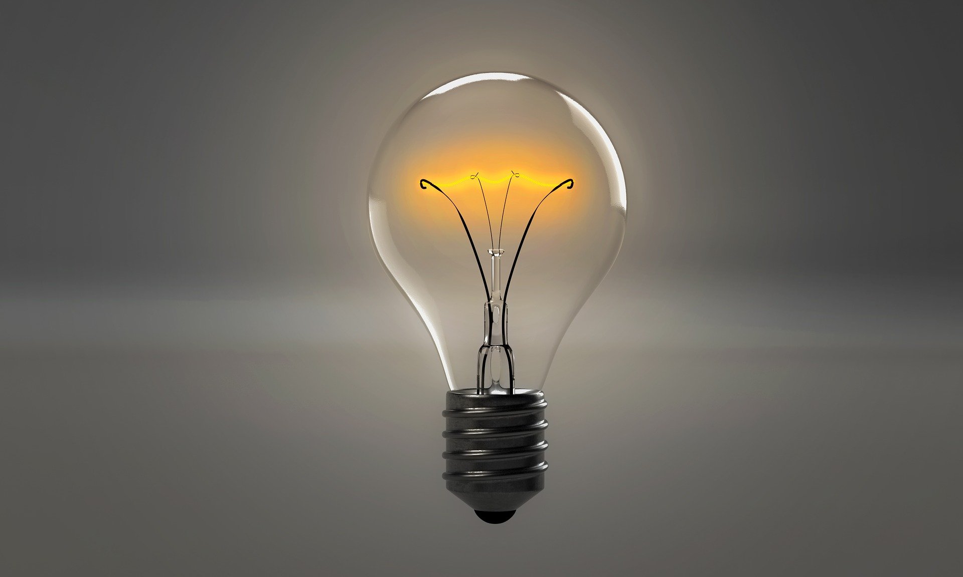 A light bulb with a flame Description automatically generated with low confidence